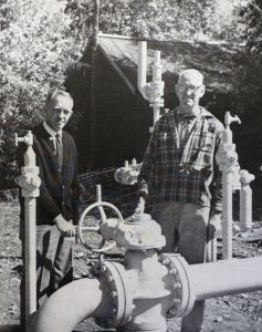 hailey_town_border_station Bob Williams, Sun Valley division manager, at the Hailey town border station with George Allen, mayor, in September 1965.